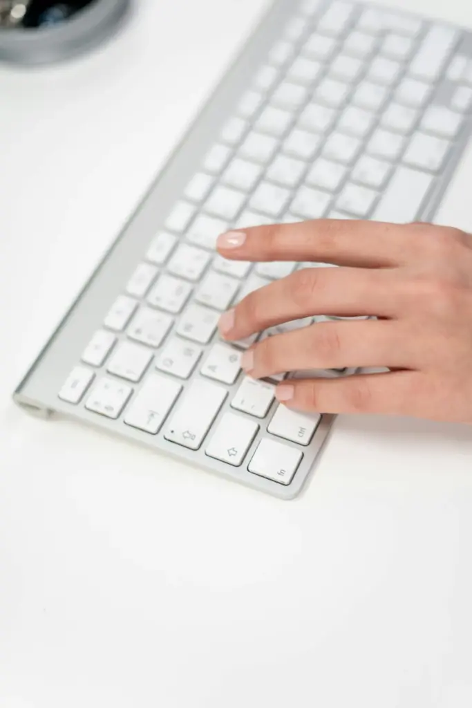 Hand typing on a modern keyboard